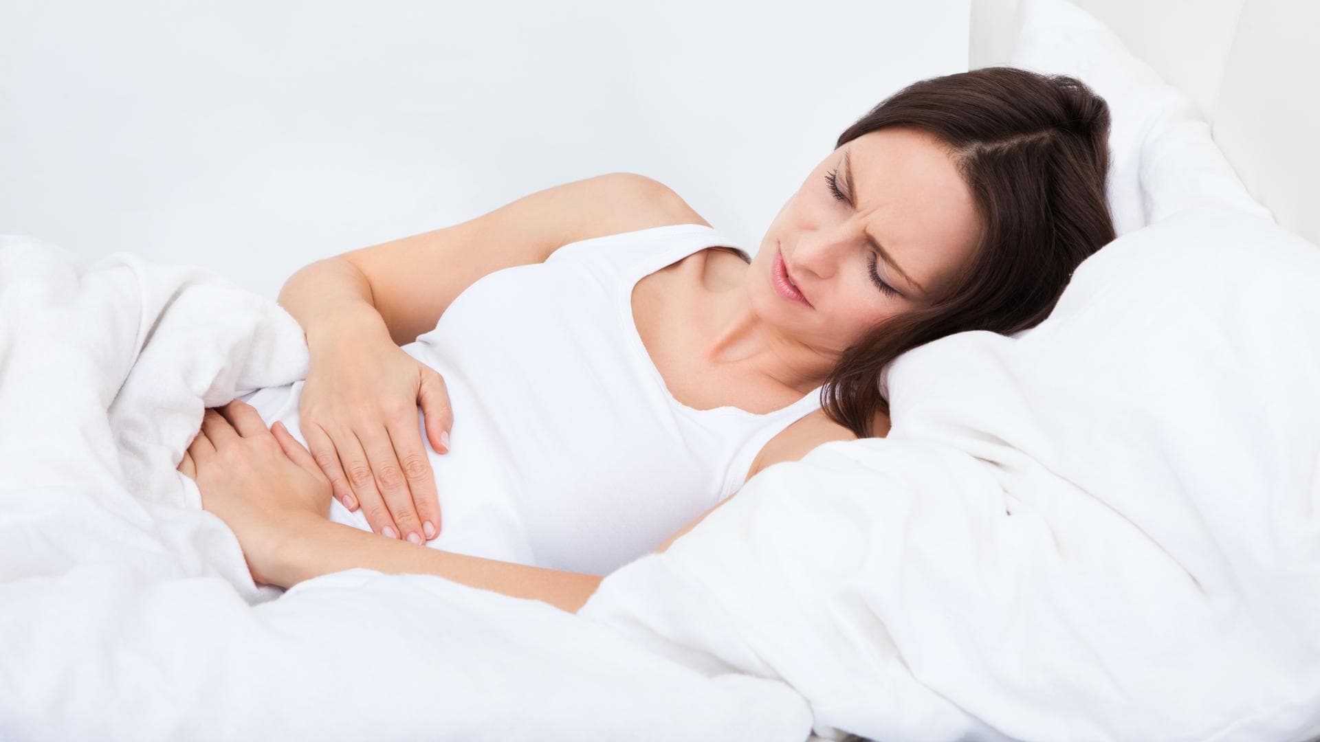 Frau mit Bauchschmerzen Frau mit Bauchschmerzen