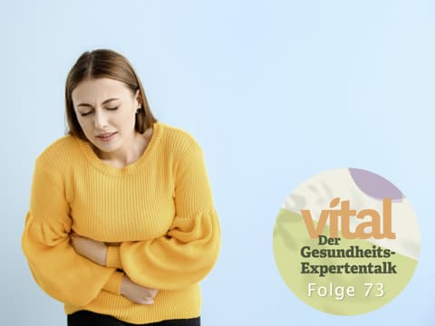 Frau mit Bauchschmerzen