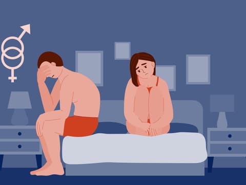 Mann und Frau sitzen auf dem Bett und haben Probleme beim Sex