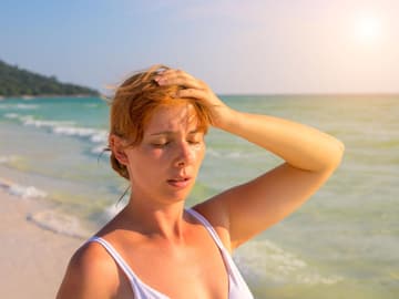 Hitzschlag_Frau Hitzschlag Frau am Strand